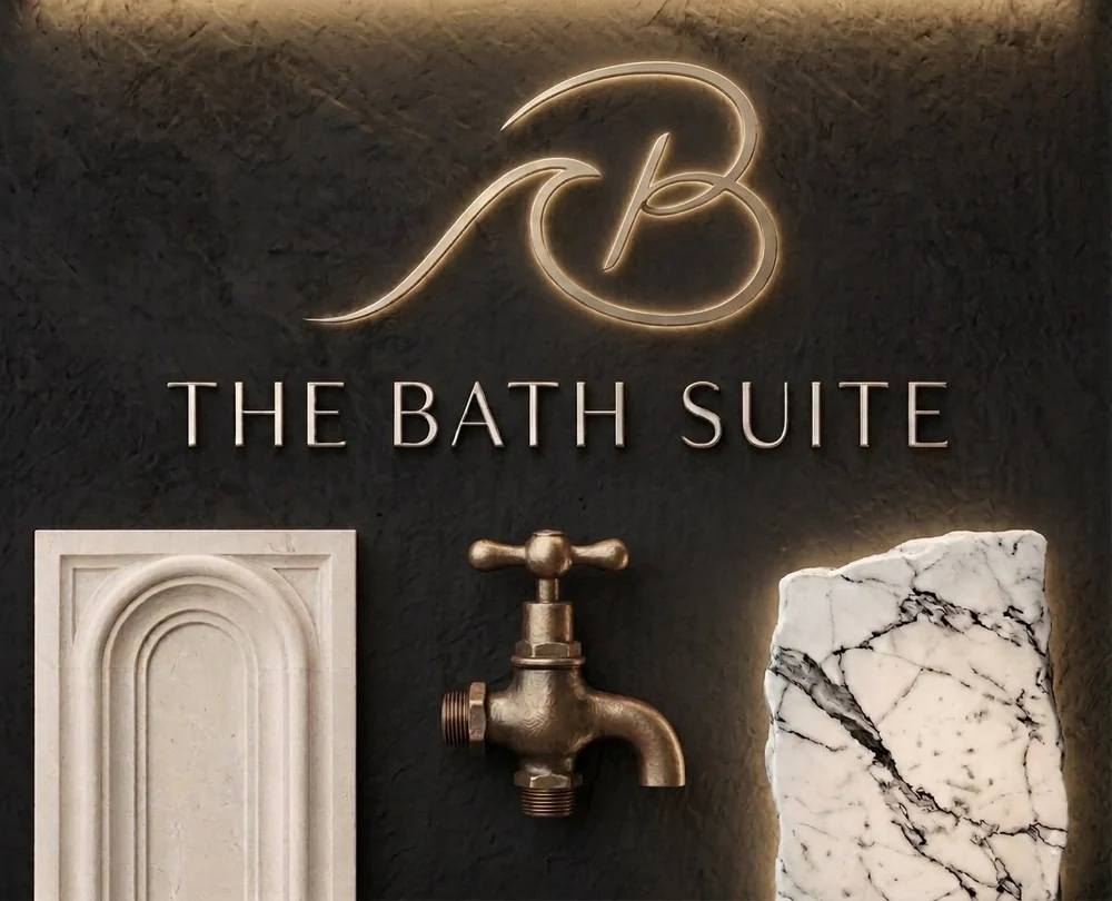 The Bath Suite brand mark, shown with a limestone arch profile, aged brass tap and marble sample.